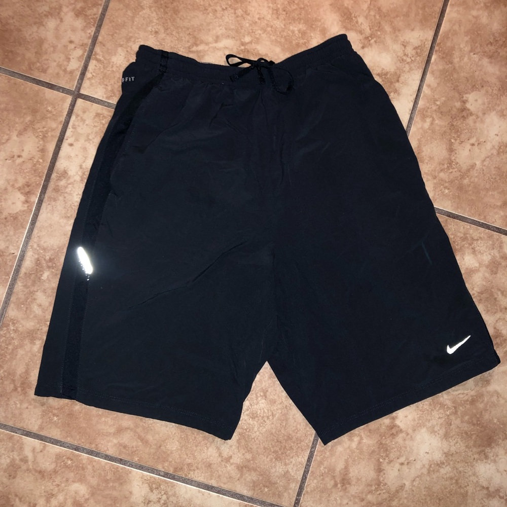 Nike small men’s dark blue dri-fit running shorts.